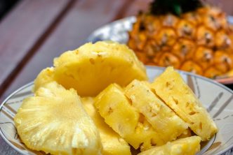 sliced pineapple on white ceramic plate