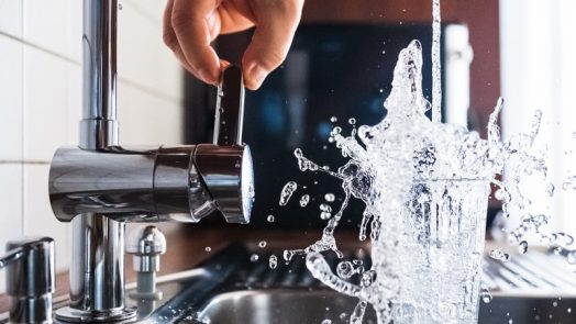 person opening faucet